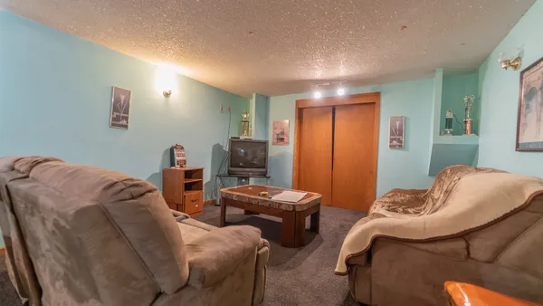 a bedroom with two beds and a couch
