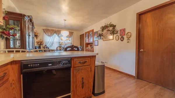 a view of a kitchen from a hallway