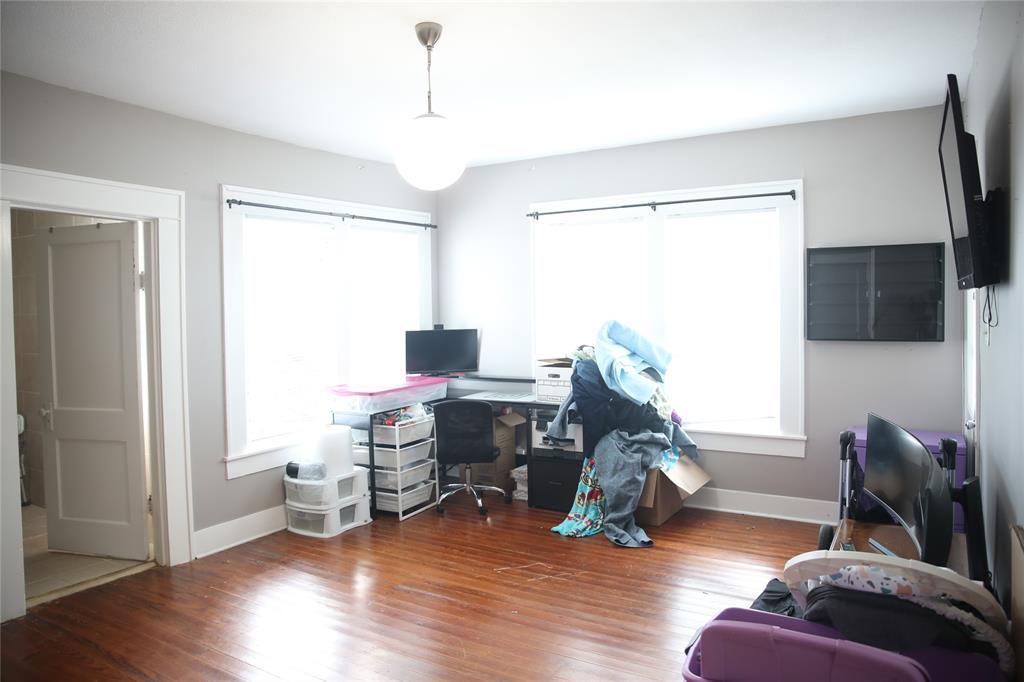 1500 Bonham Street Commerce, TX 75428 - Photo 11 of 29 a livingroom with furniture a ceiling fan and wooden floor