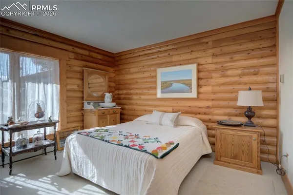 a bedroom with a bed and a cabinets