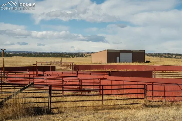 a view of an empty room with wooden walls