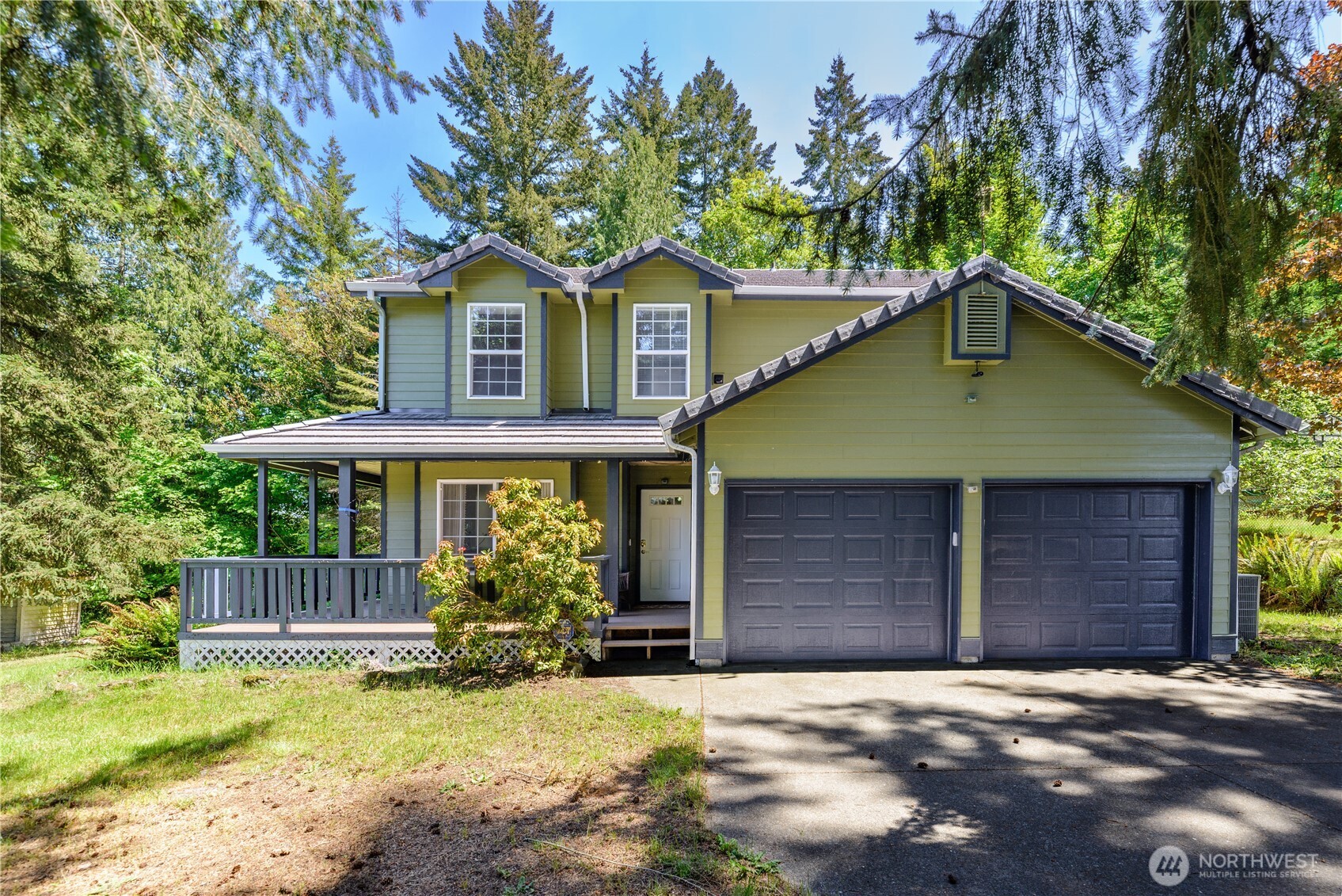 301 Mt Pleasant Estates Road Port Angeles, WA 98362 - Photo 2 of 40 a front view of a house with garden