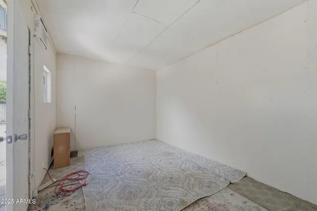 a view of room with wooden floor