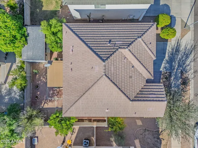 an aerial view of residential houses with outdoor space