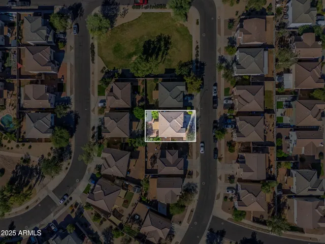 an aerial view of residential houses with outdoor space