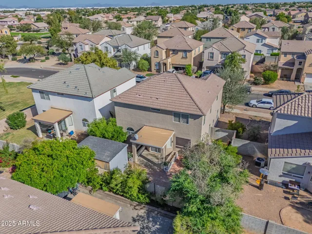 an aerial view of residential houses with outdoor space