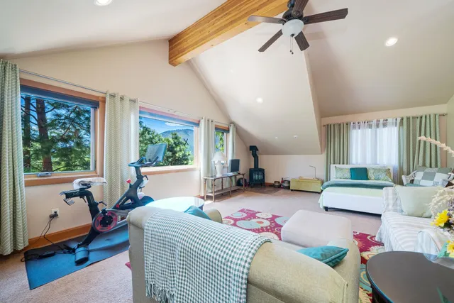 a bedroom with furniture and a window