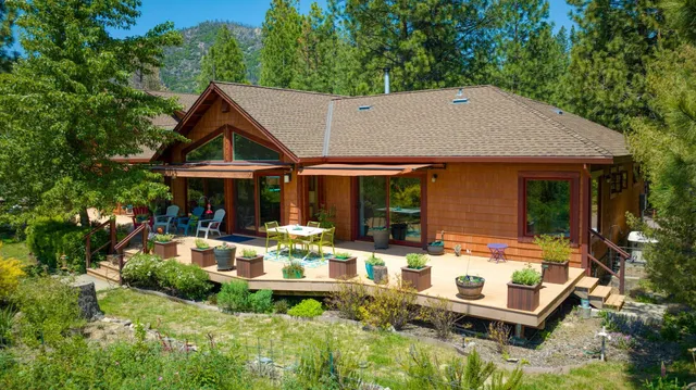 a view of house with a yard outdoor seating and green space