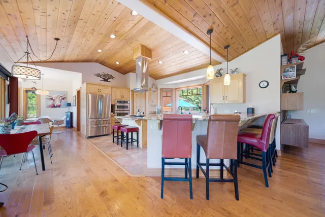 a view of a dining area with furniture and a chandelier