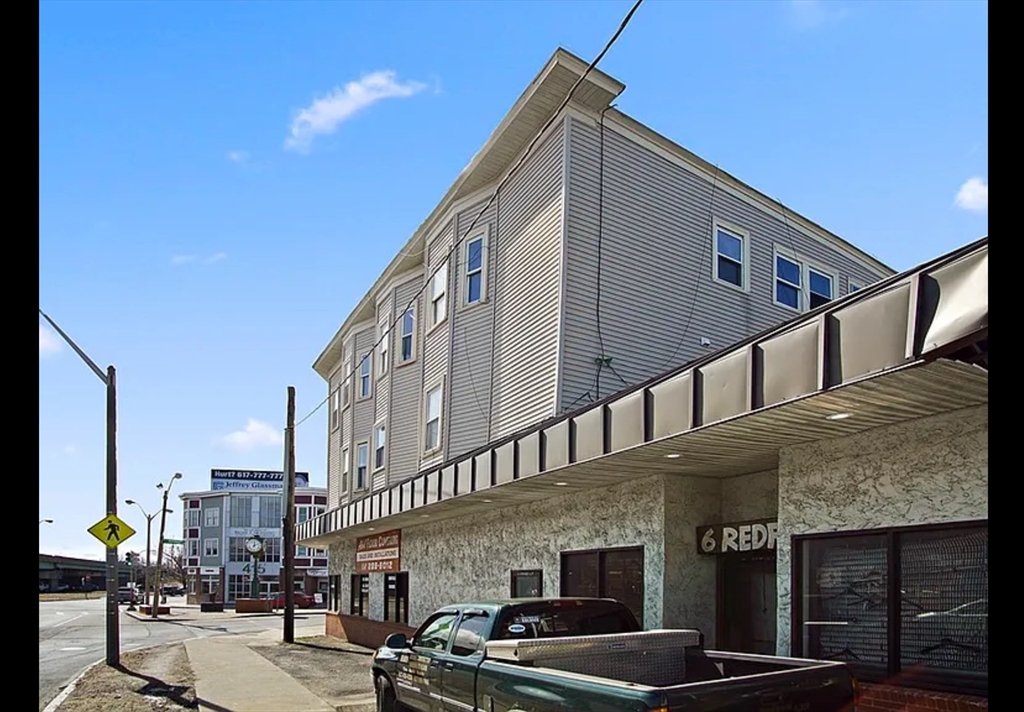 2 Redfield Street, Unit 2 Boston, MA 02122 - Photo 14 of 14 a large building with a street