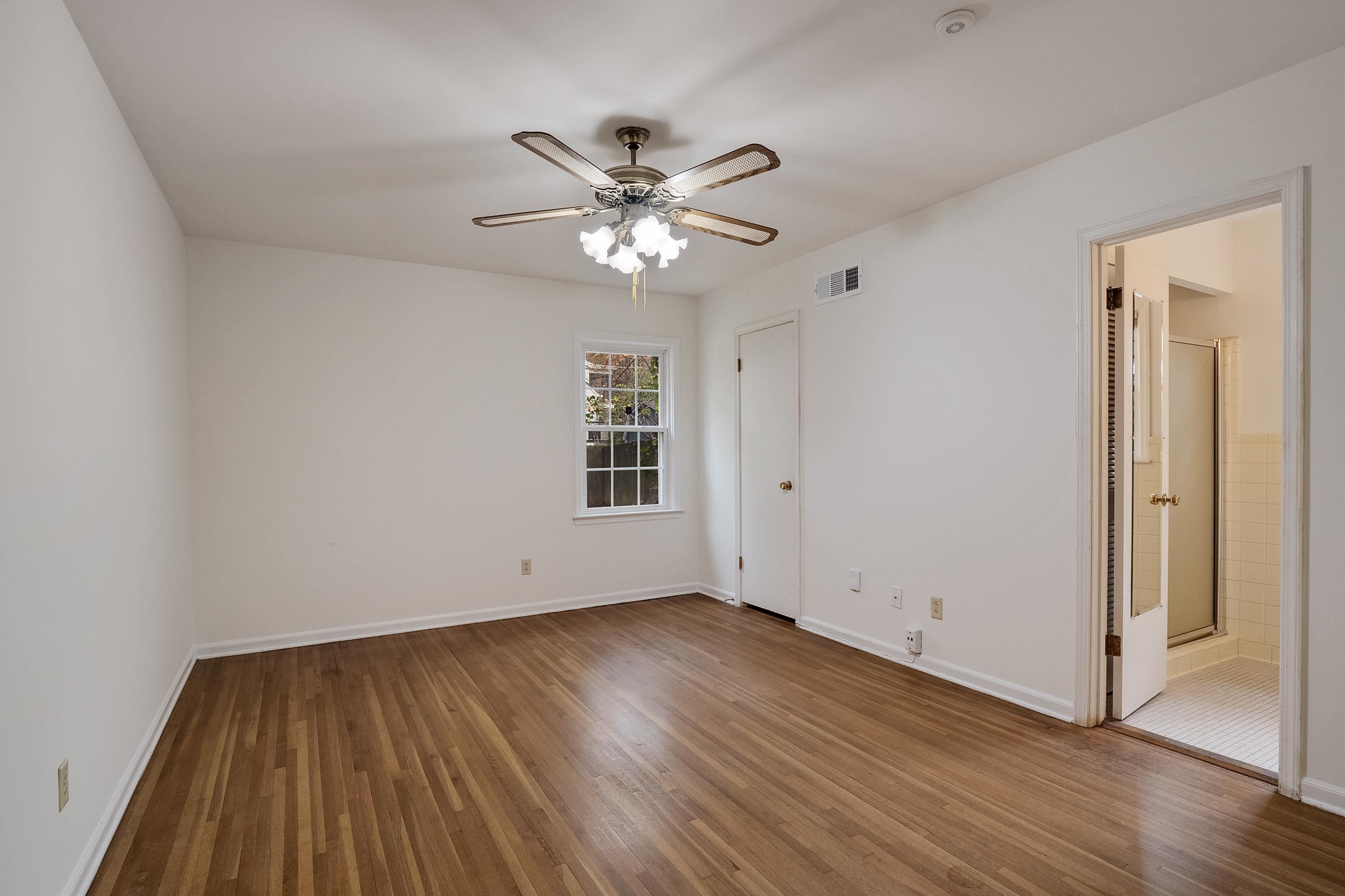 5500 Quince Road Memphis, TN 38119 - Photo 16 of 31 wooden floor in an empty room with a window