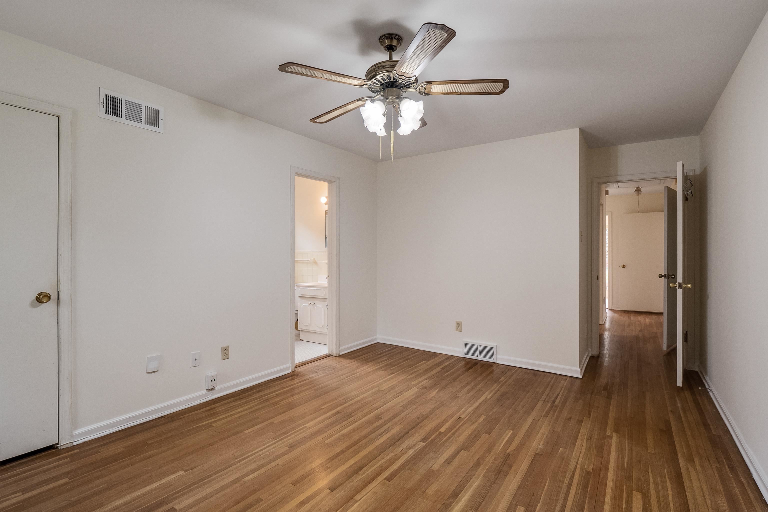 5500 Quince Road Memphis, TN 38119 - Photo 17 of 31 wooden floor in an empty room with a window