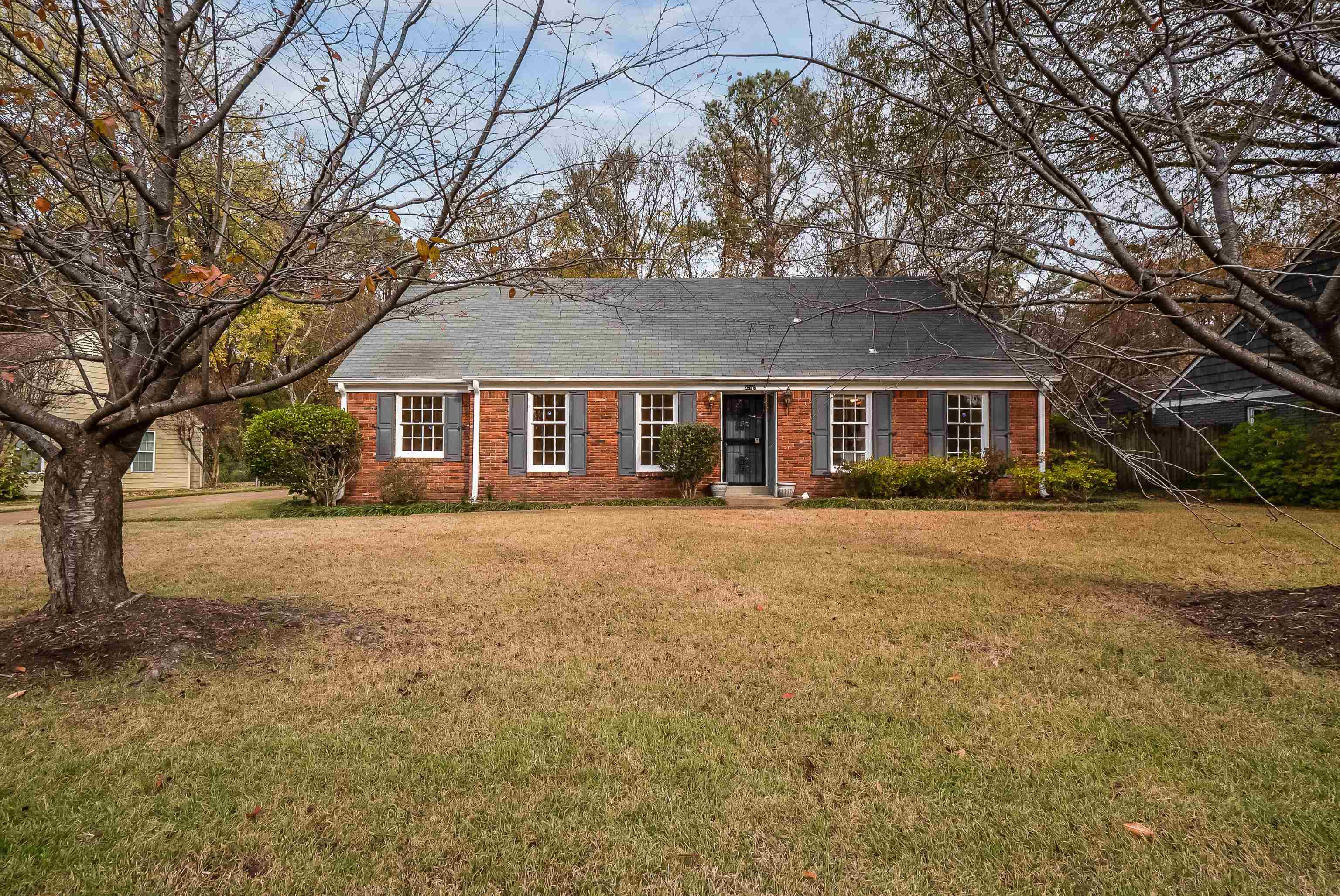 5500 Quince Road Memphis, TN 38119 - Photo 2 of 31 a front view of a house with a garden