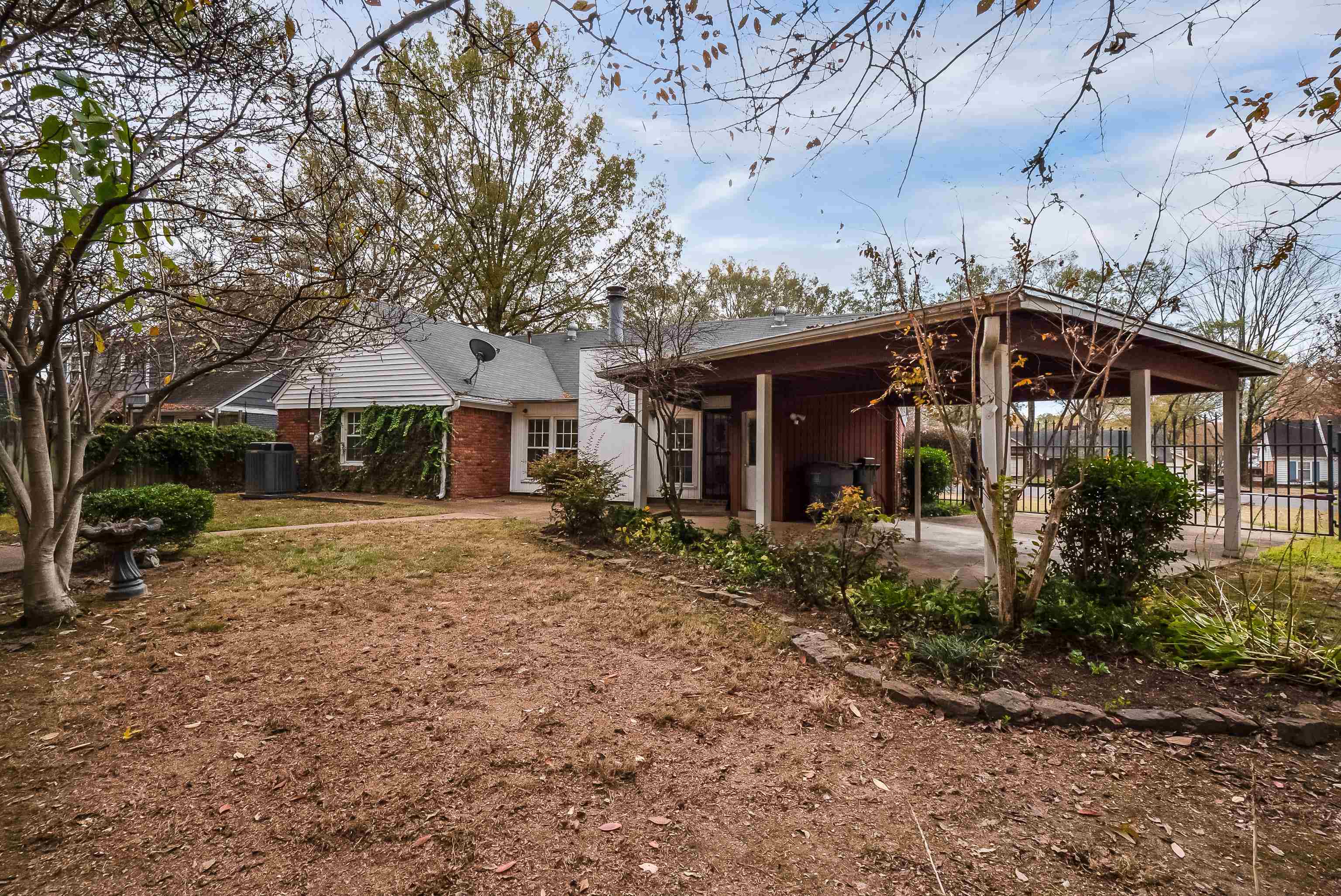 5500 Quince Road Memphis, TN 38119 - Photo 30 of 31 a front view of a house with garden