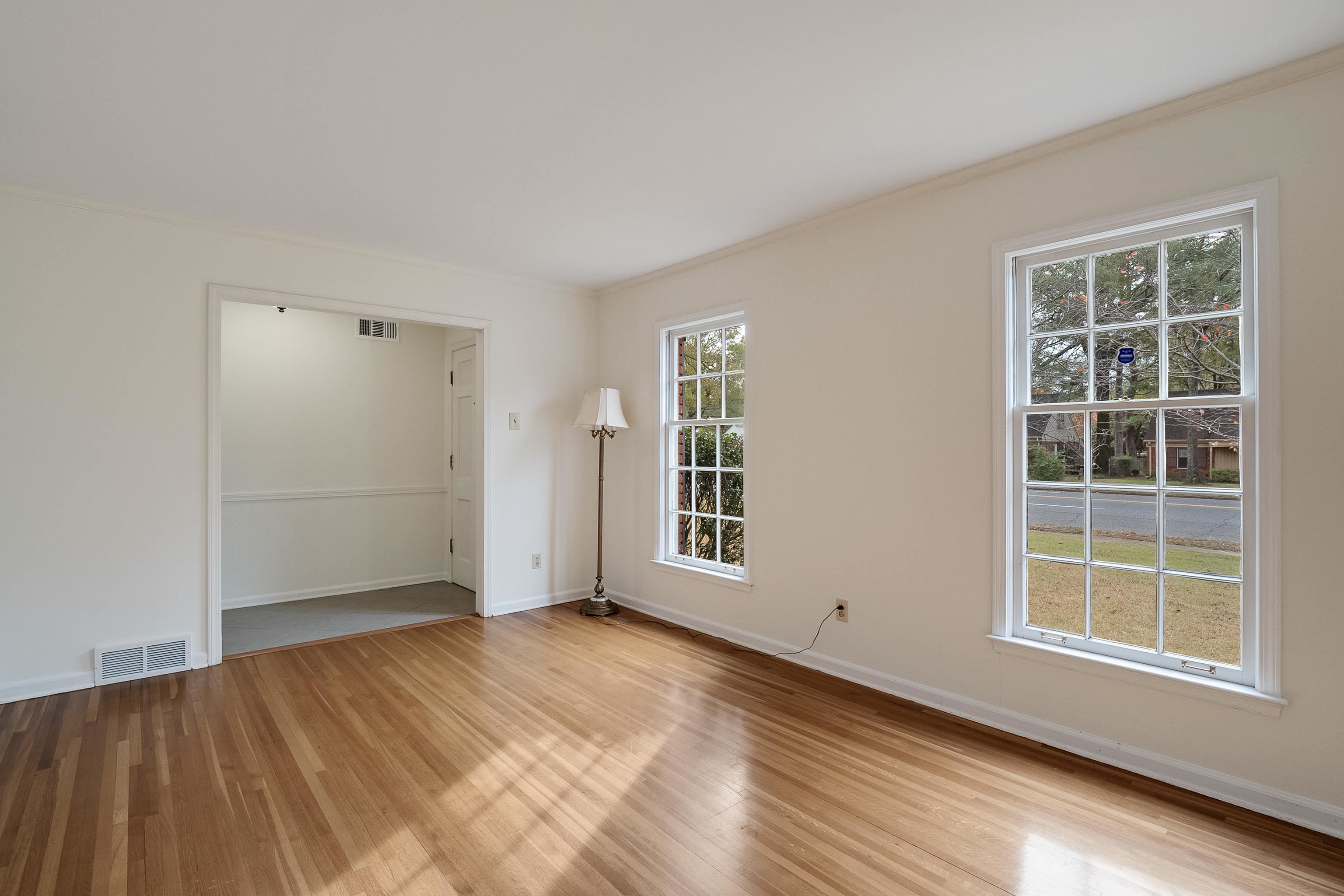 5500 Quince Road Memphis, TN 38119 - Photo 5 of 31 an empty room with wooden floor and windows