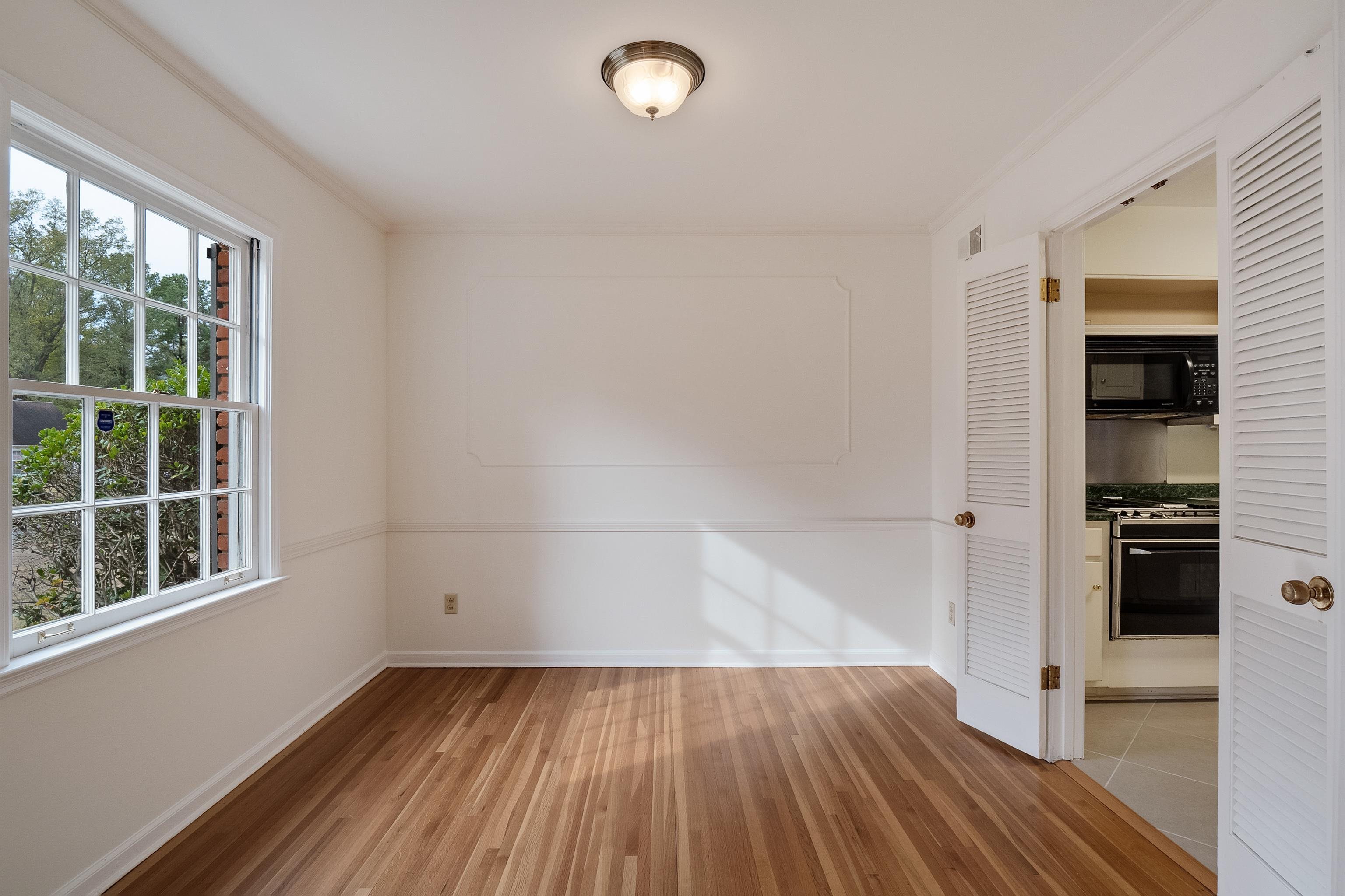 5500 Quince Road Memphis, TN 38119 - Photo 7 of 31 wooden floor in an empty room with a window