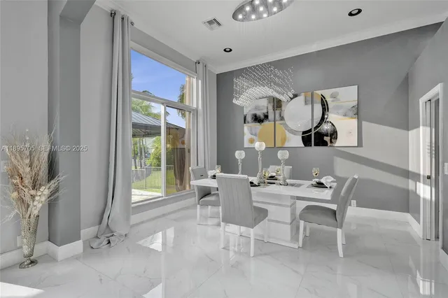 a kitchen with stainless steel appliances kitchen island granite countertop a sink and cabinets