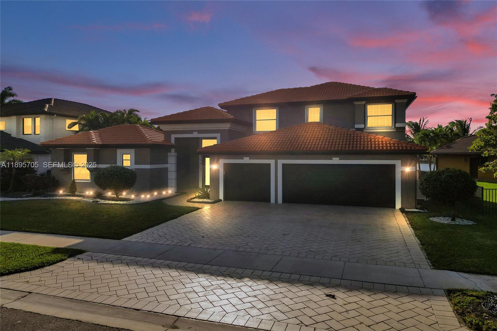 4248 Southwest 185th Avenue Miramar, FL 33029 - Photo 2 of 88 a front view of a house with a yard