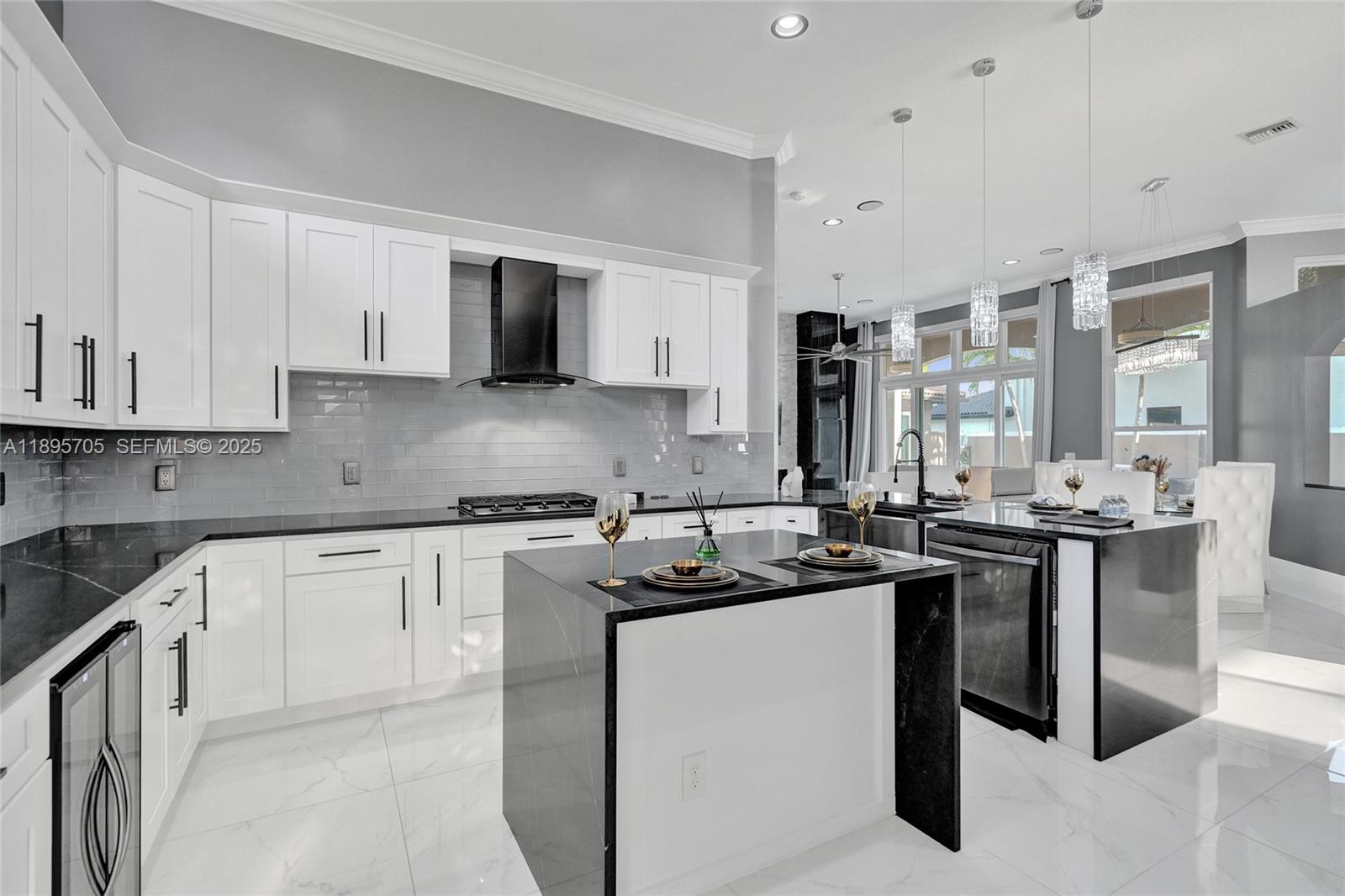 4248 Southwest 185th Avenue Miramar, FL 33029 - Photo 21 of 88 a kitchen with stainless steel appliances granite countertop a sink stove and cabinets