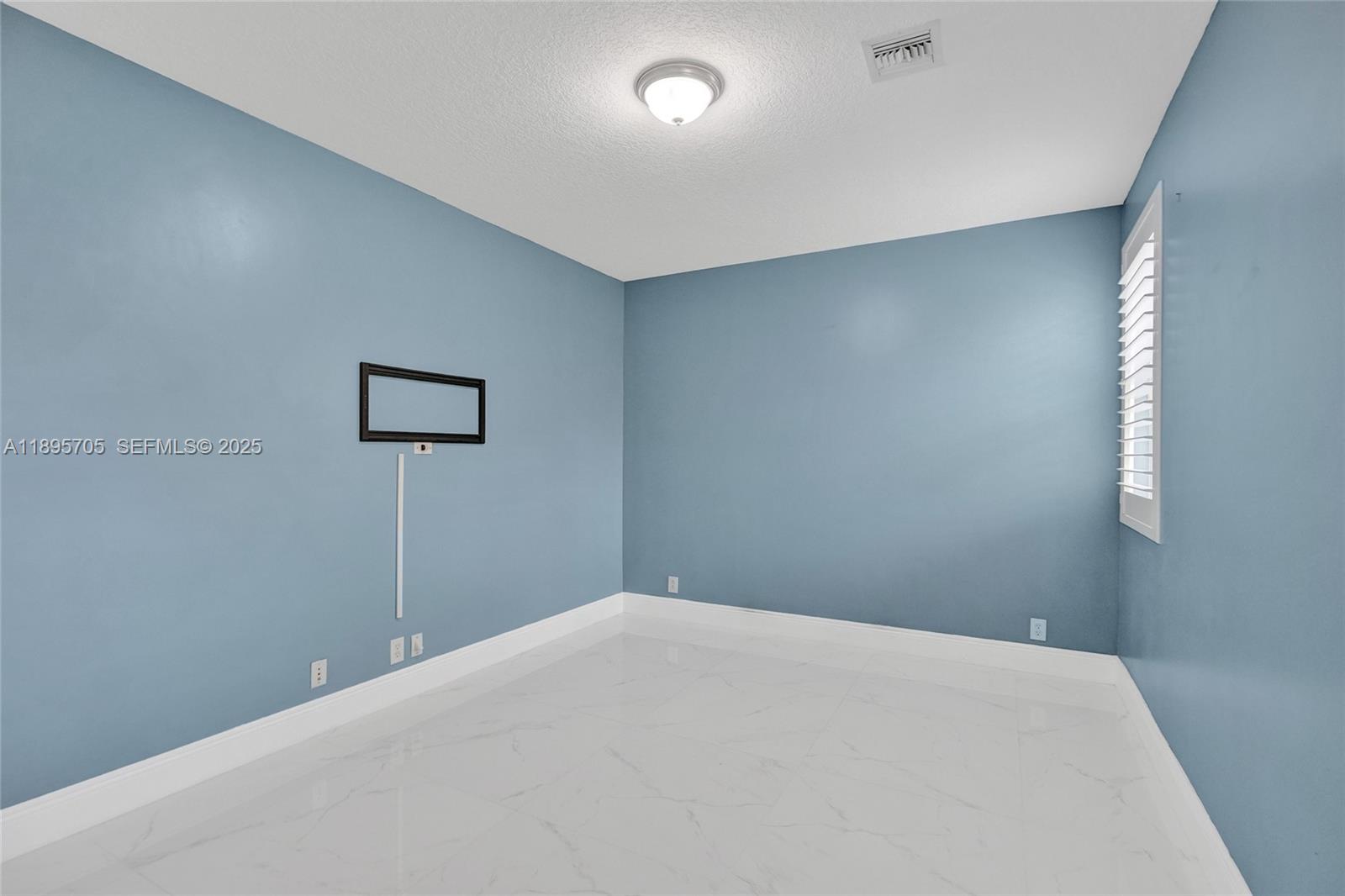 4248 Southwest 185th Avenue Miramar, FL 33029 - Photo 30 of 88 a bedroom with a bed