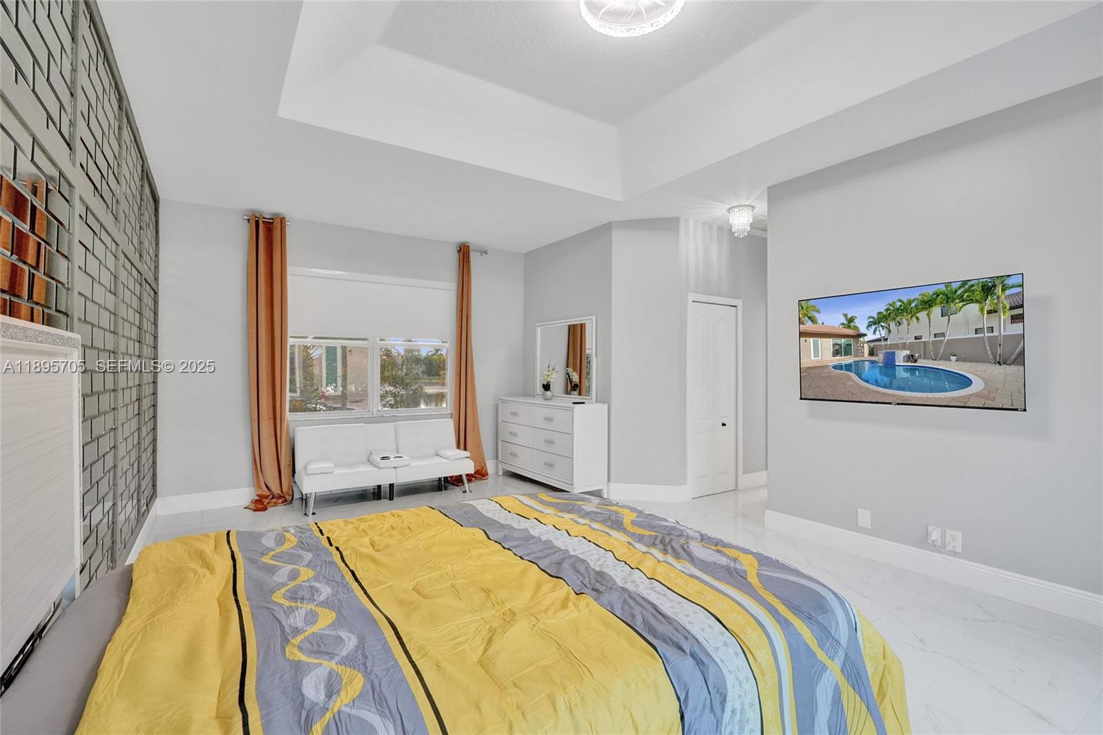 4248 Southwest 185th Avenue Miramar, FL 33029 - Photo 40 of 88 a bedroom with a bed and a painting on the wall