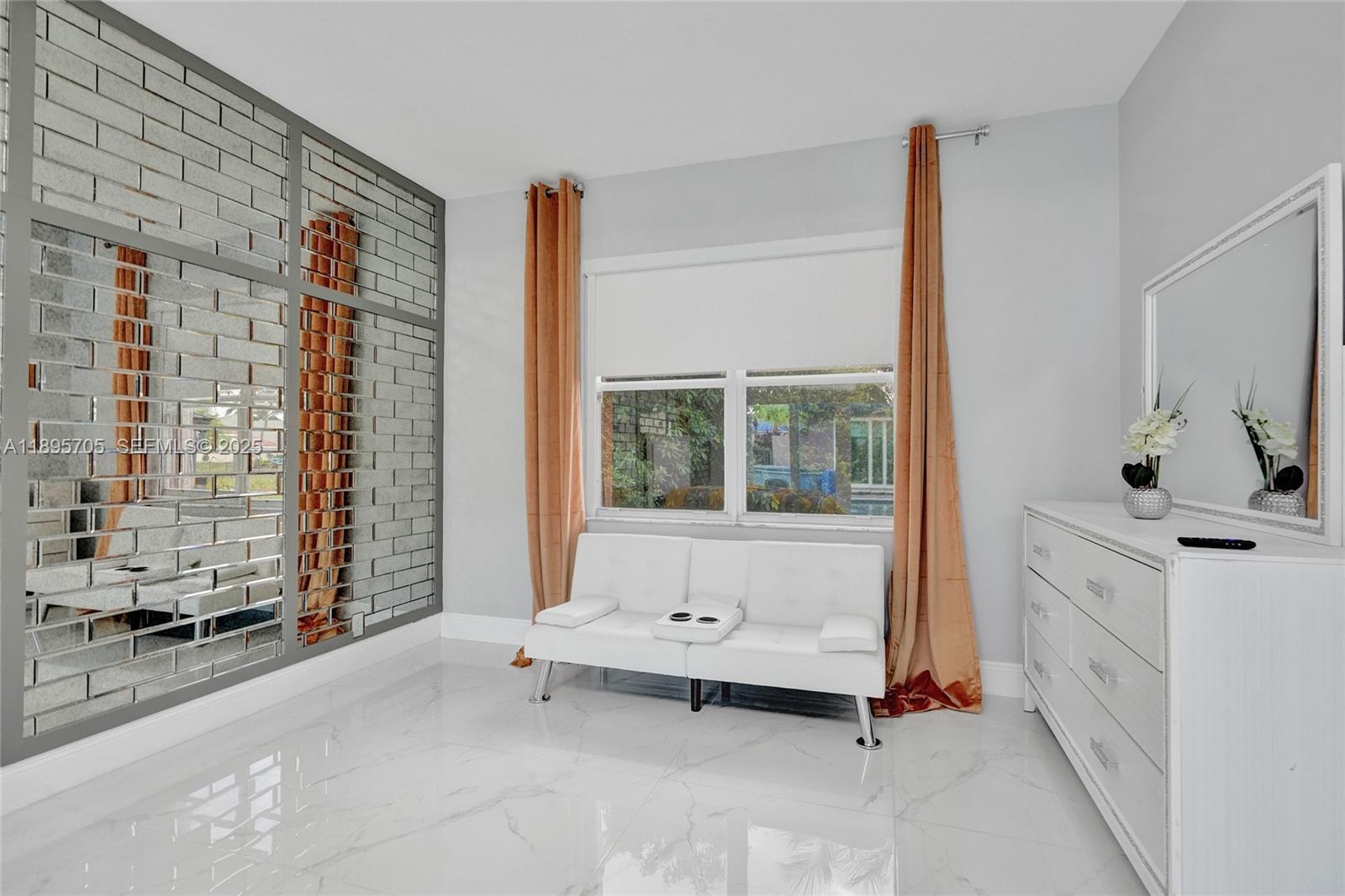 4248 Southwest 185th Avenue Miramar, FL 33029 - Photo 42 of 88 a spacious bedroom with a large bed and a window