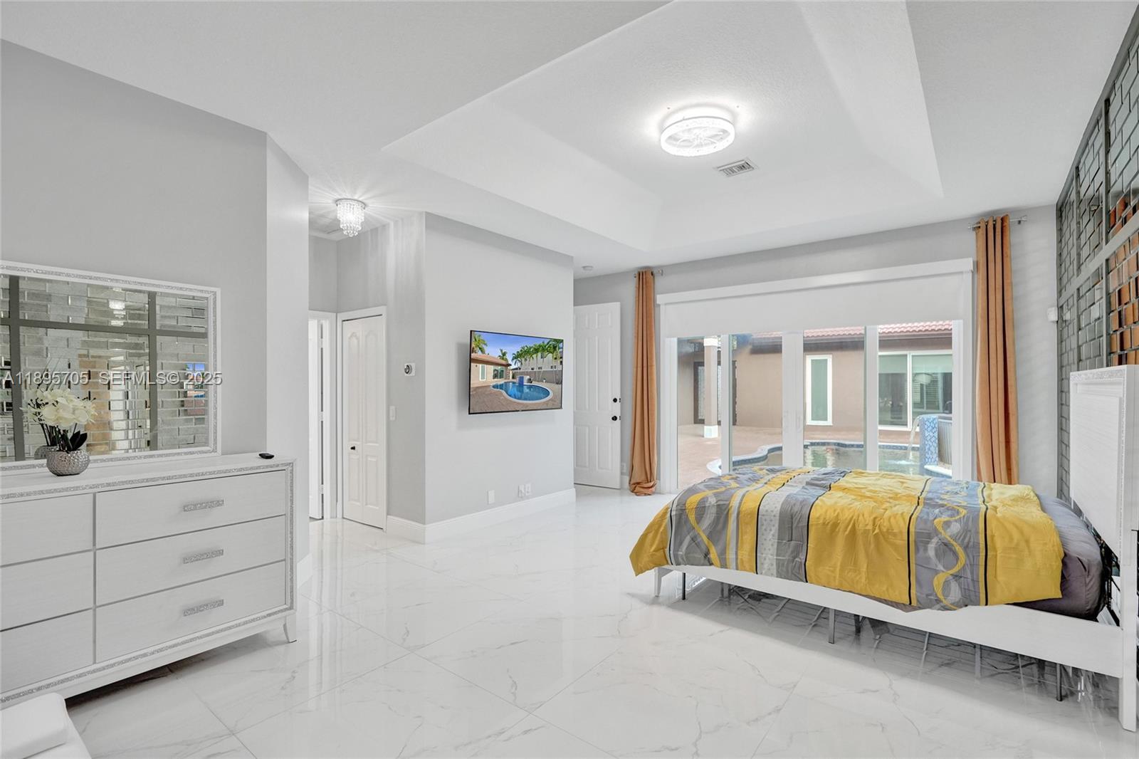 4248 Southwest 185th Avenue Miramar, FL 33029 - Photo 43 of 88 a bedroom with a bed and a dresser