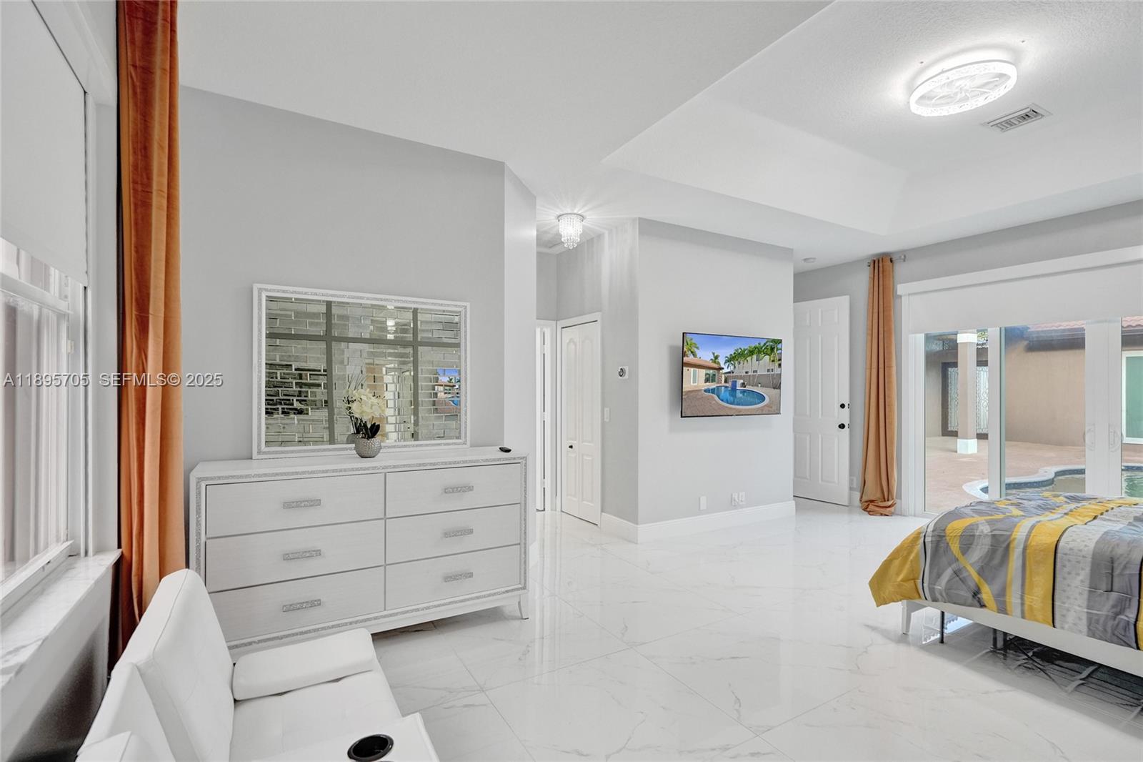 4248 Southwest 185th Avenue Miramar, FL 33029 - Photo 44 of 88 a spacious bedroom with a bed and a window