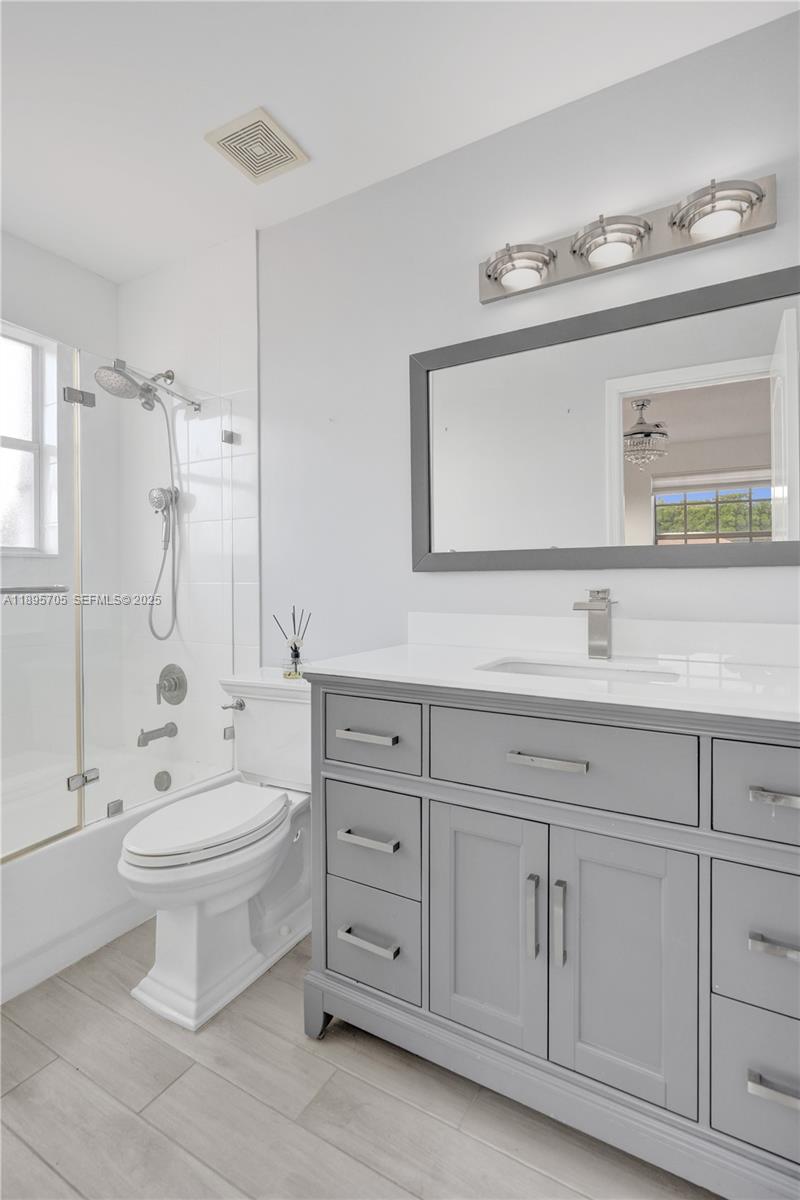 4248 Southwest 185th Avenue Miramar, FL 33029 - Photo 63 of 88 a bathroom with a sink toilet and shower