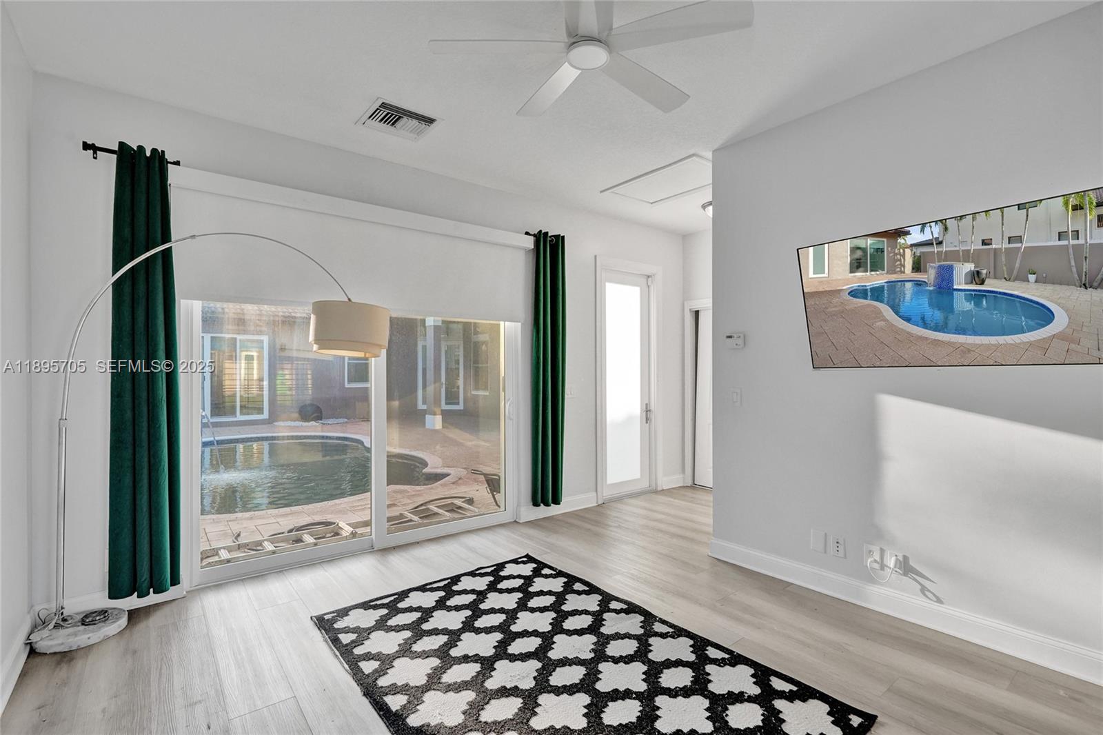 4248 Southwest 185th Avenue Miramar, FL 33029 - Photo 65 of 88 a bedroom with a bed and a window