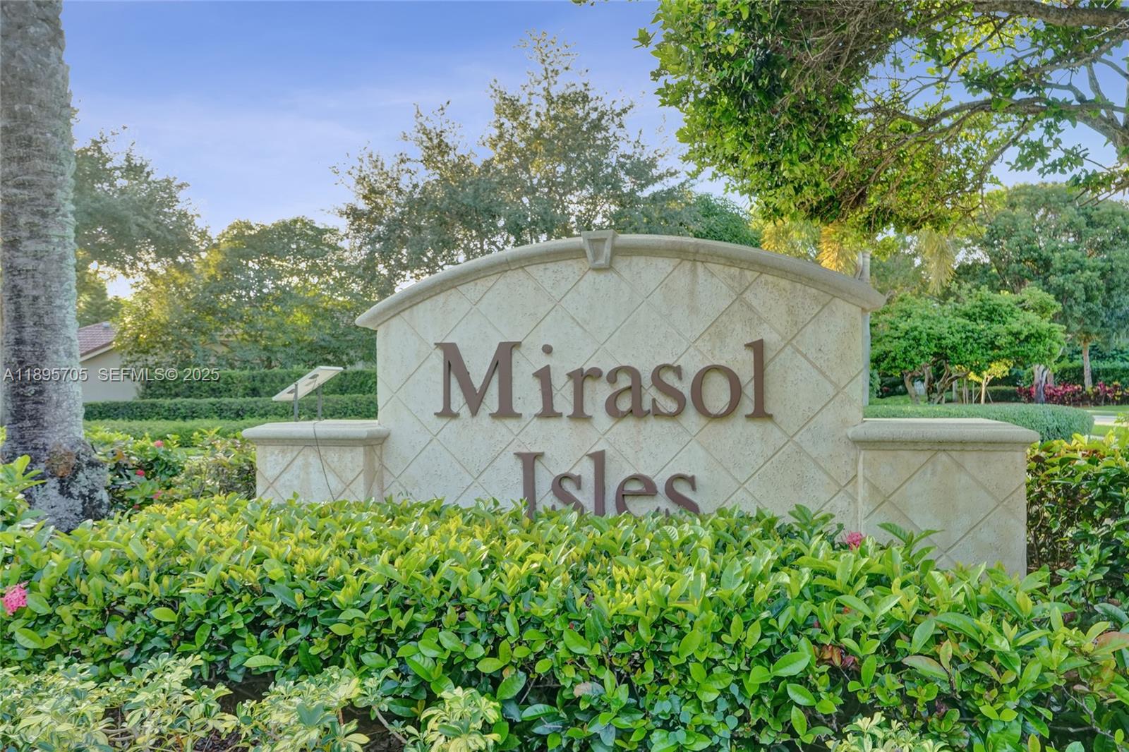 4248 Southwest 185th Avenue Miramar, FL 33029 - Photo 88 of 88 a sign of golf club on a wall under a tree