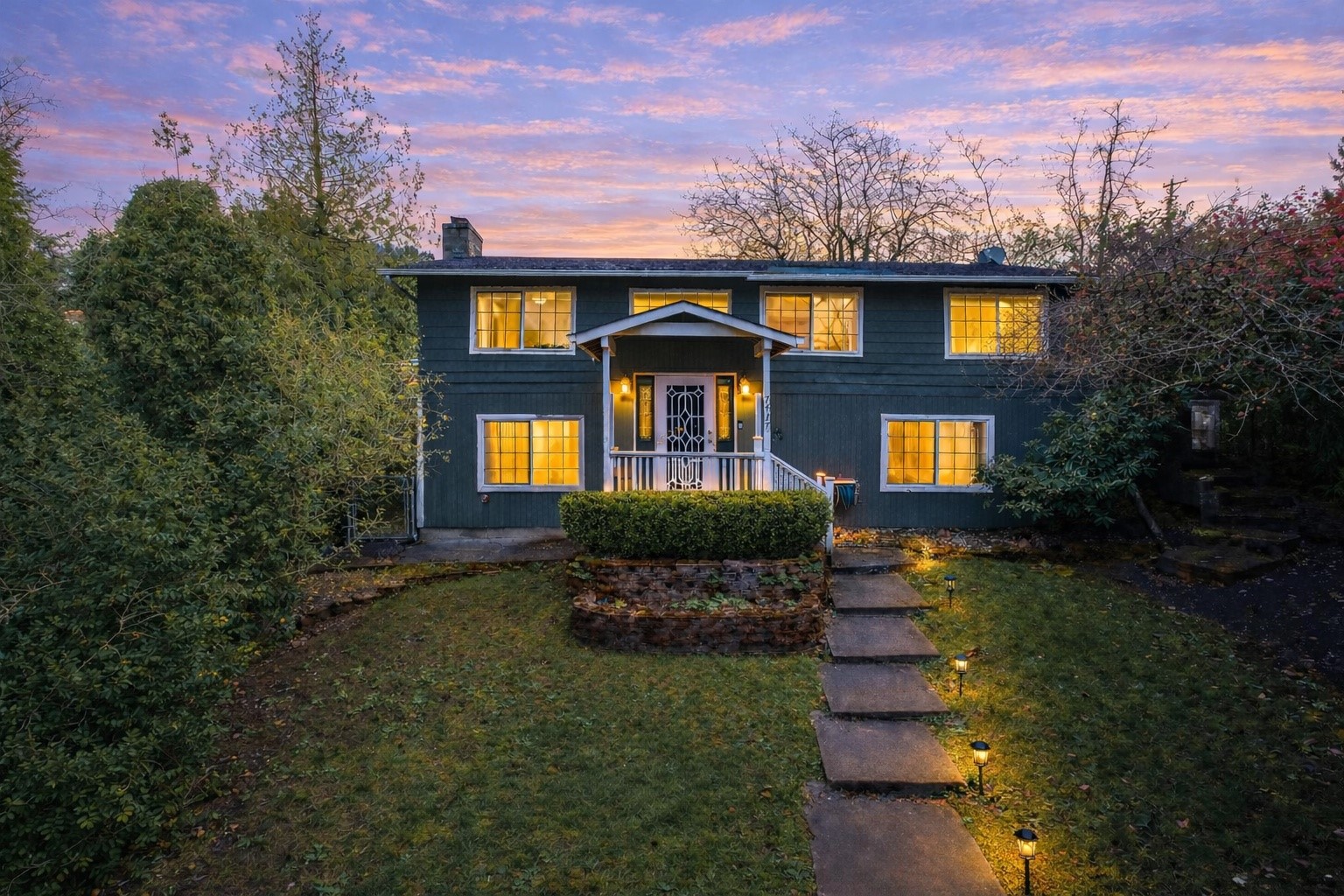 7417 South Prospect Street Tacoma, WA 98409 - Photo 1 of 35 a front view of a house with a yard