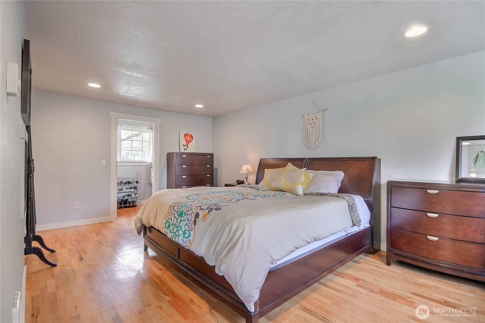 7417 South Prospect Street Tacoma, WA 98409 - Photo 16 of 35 a bedroom with bed and wooden floor