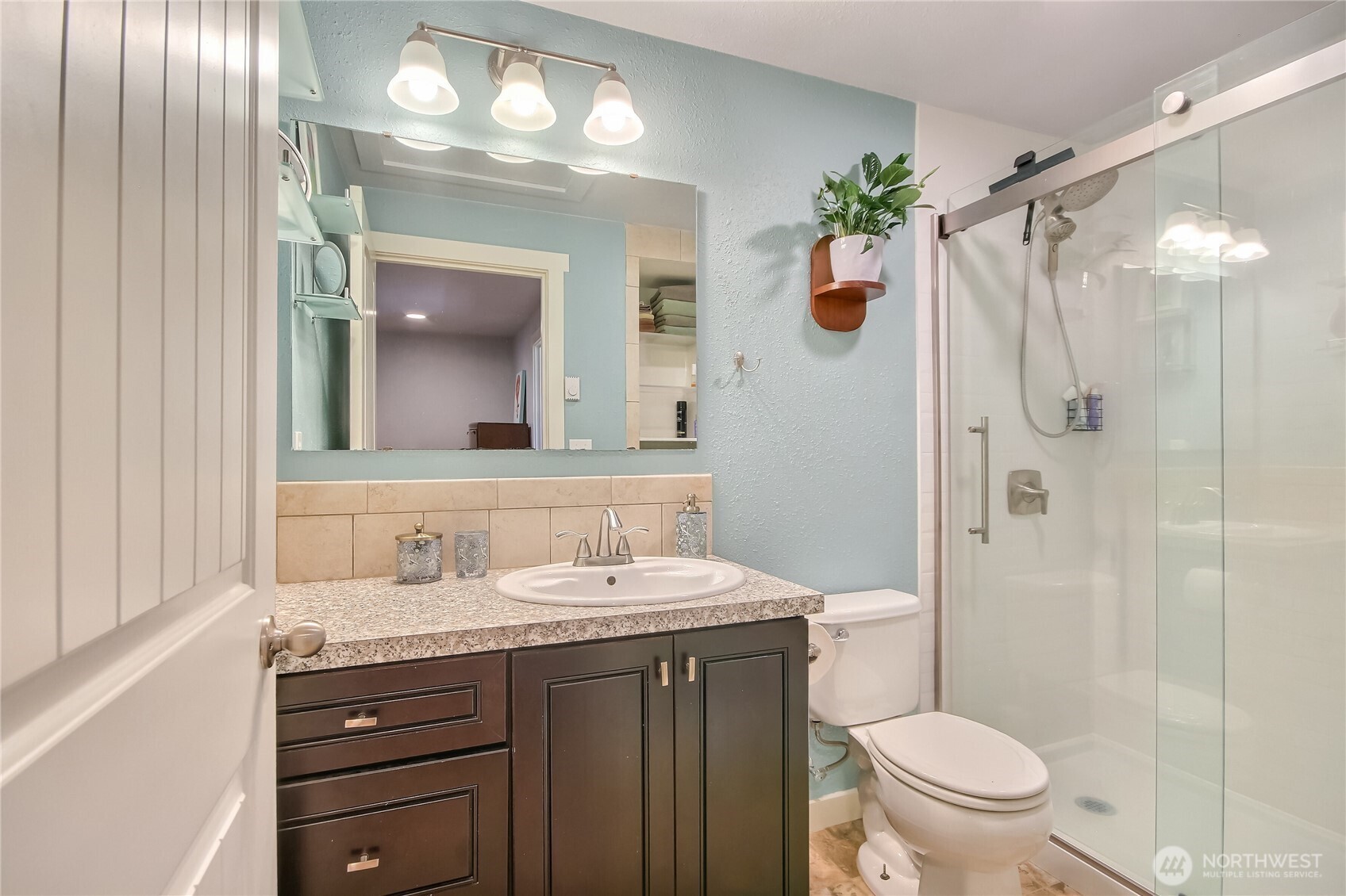 7417 South Prospect Street Tacoma, WA 98409 - Photo 18 of 35 a bathroom with a granite countertop sink toilet and shower