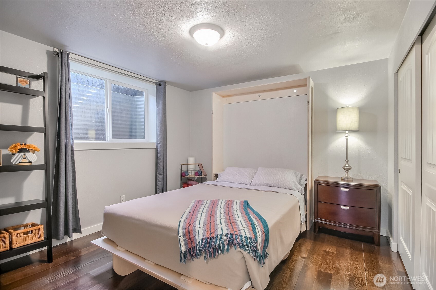 7417 South Prospect Street Tacoma, WA 98409 - Photo 22 of 35 a bedroom with a bed and a window