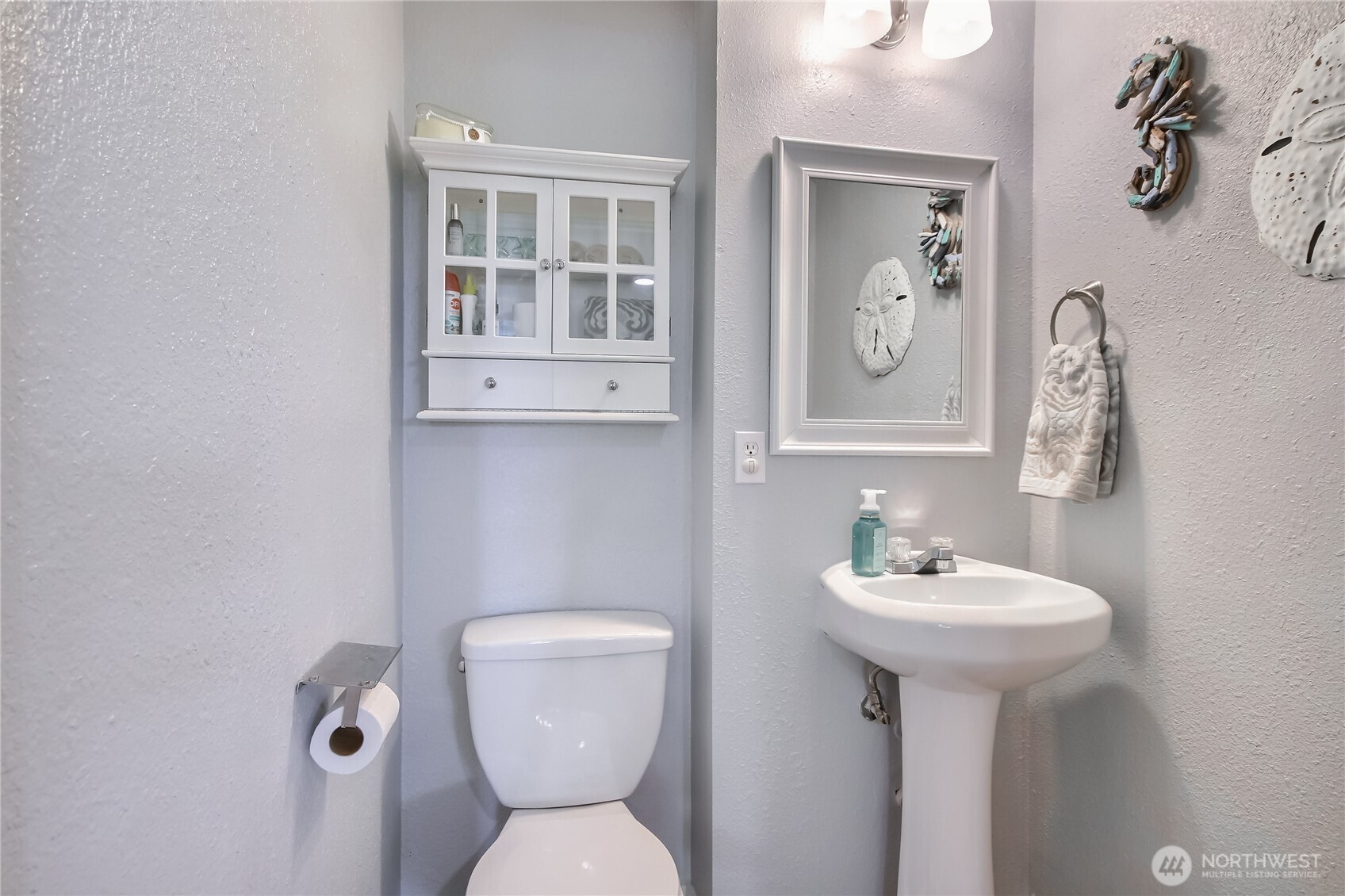 7417 South Prospect Street Tacoma, WA 98409 - Photo 24 of 35 a bathroom with a toilet sink and mirror