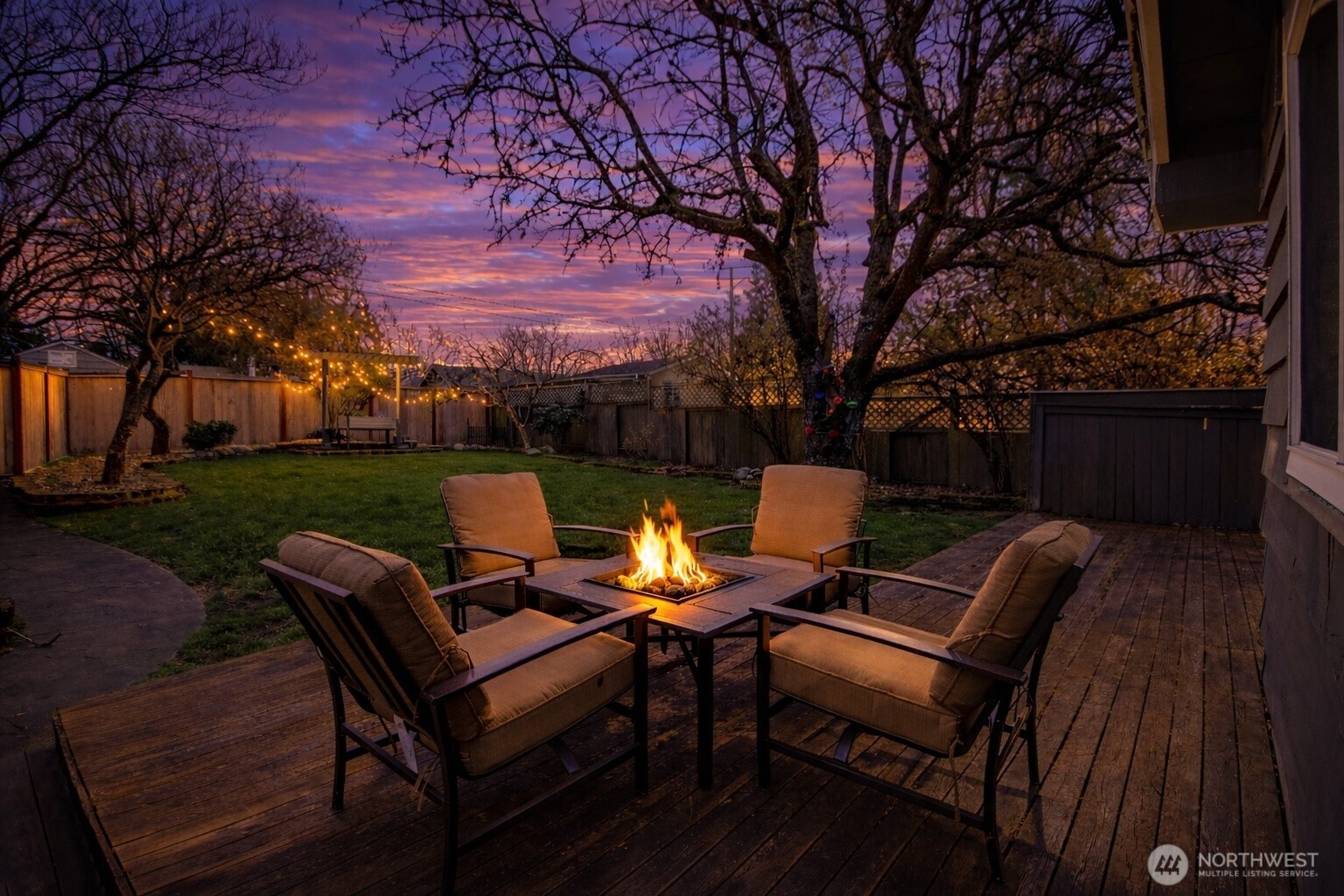 7417 South Prospect Street Tacoma, WA 98409 - Photo 26 of 35 a view of a patio with a table chairs and a fire pit