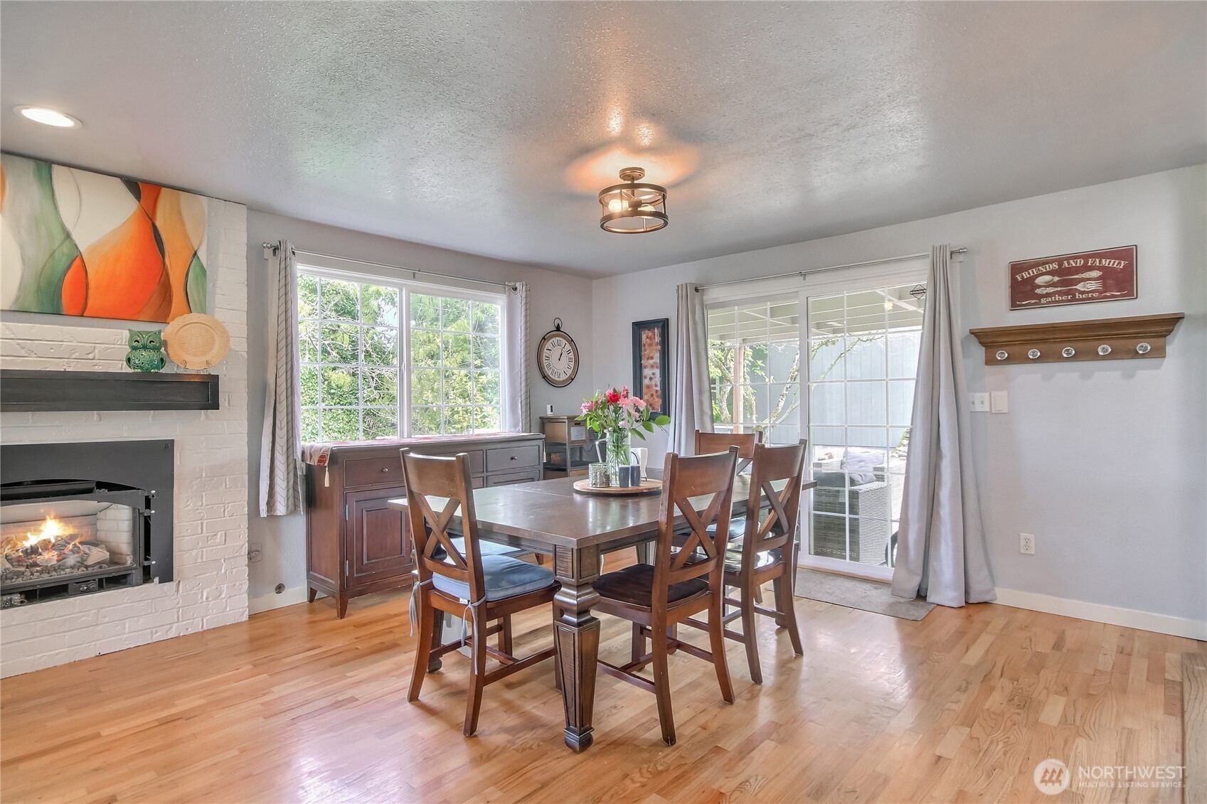 7417 South Prospect Street Tacoma, WA 98409 - Photo 7 of 35 a view of a dining room with furniture window and wooden floor