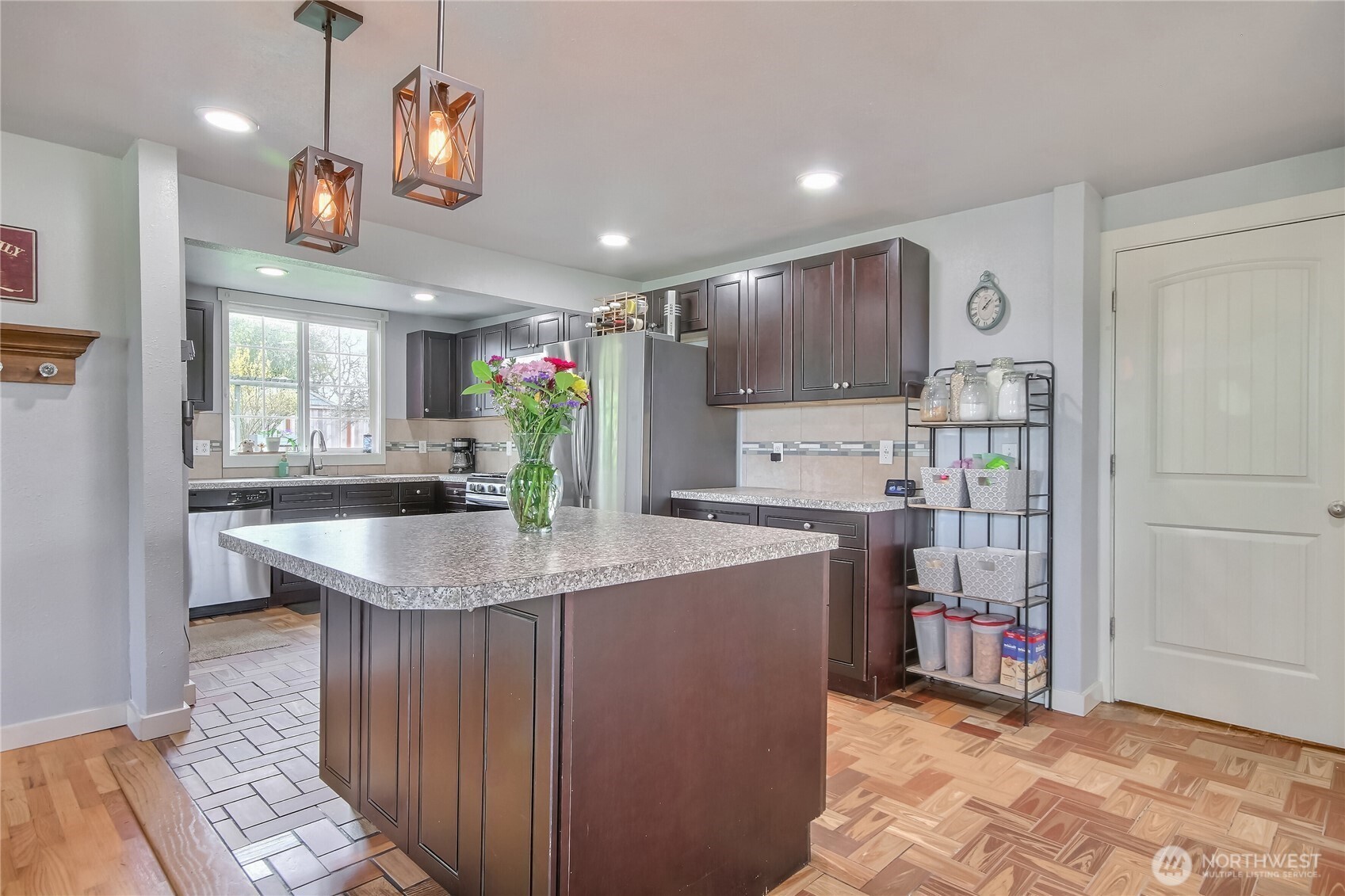 7417 South Prospect Street Tacoma, WA 98409 - Photo 10 of 35 a kitchen with stainless steel appliances granite countertop a sink a stove a refrigerator and a refrigerator