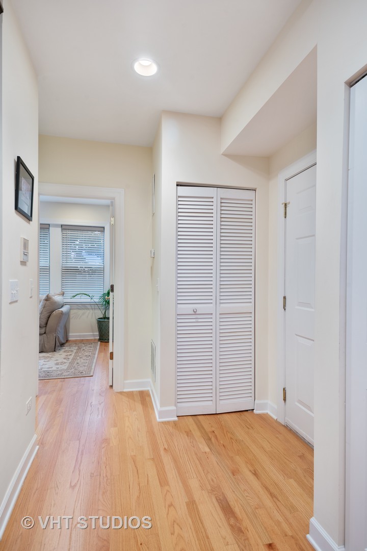 3339 West Byron Street, Unit 1 Chicago, IL 60618 - Photo 2 of 12 a view of empty room with wooden floor