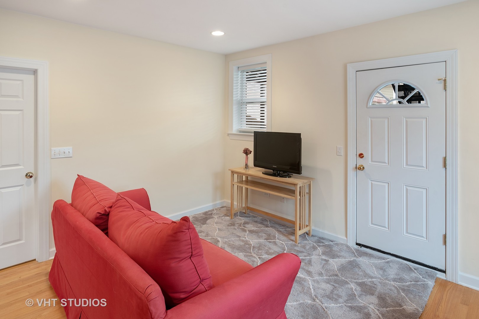 3339 West Byron Street, Unit 1 Chicago, IL 60618 - Photo 3 of 12 a living room with furniture and a flat screen tv