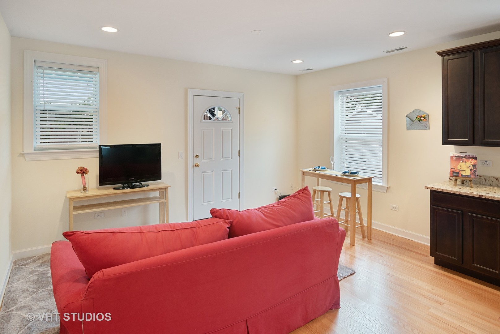 3339 West Byron Street, Unit 1 Chicago, IL 60618 - Photo 4 of 12 a living room with furniture and a flat screen tv