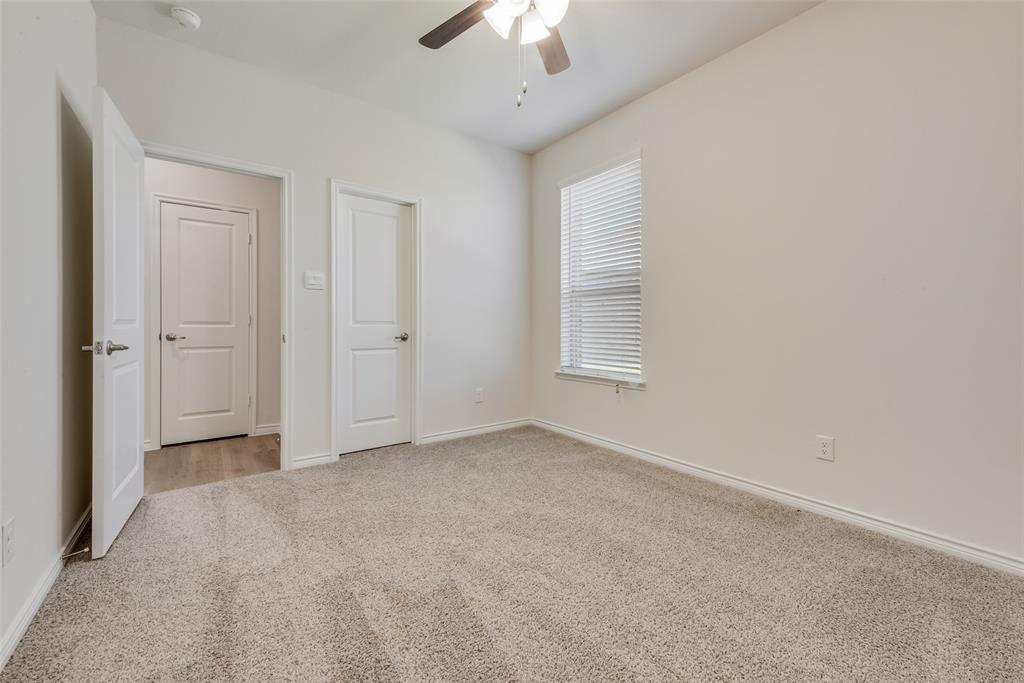 1532 Ruby Jewel Lane Anna, TX 75409 - Photo 14 of 19 an empty room with a ceiling fan and a window