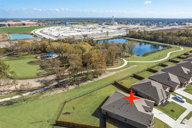 a view of a swimming pool with a yard