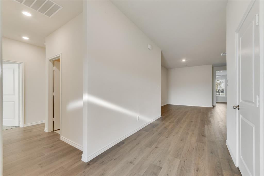 1532 Ruby Jewel Lane Anna, TX 75409 - Photo 5 of 19 an empty room with wooden floor and entrance