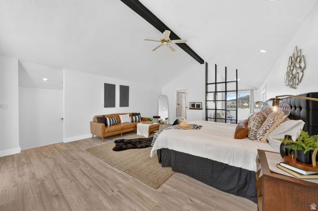 1979 Cave Hollow Way Bountiful, UT 84010 - Photo 26 of 59 Spacious room featuring vaulted ceilings with exposed beams, wood-finish flooring, a built-in room divider with a grid design, recessed lighting, and a ceiling fan