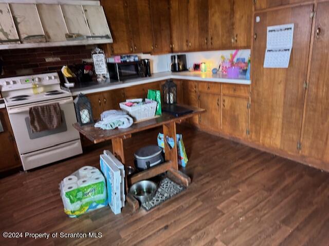 907 Rattlesnake Hill Road Meshoppen, PA 18630 - Photo 8 of 21 a kitchen with stainless steel appliances kitchen island granite countertop a table and chairs in it