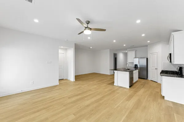 a view of a kitchen with a sink and microwave