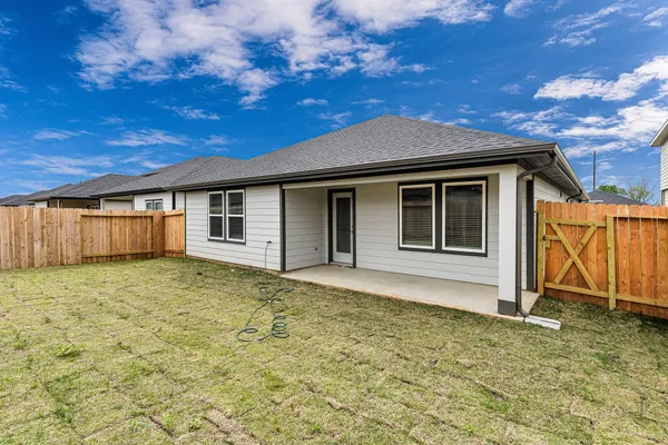 a house with yard in front of it