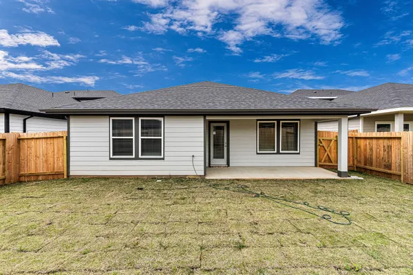 a house with yard in front of it